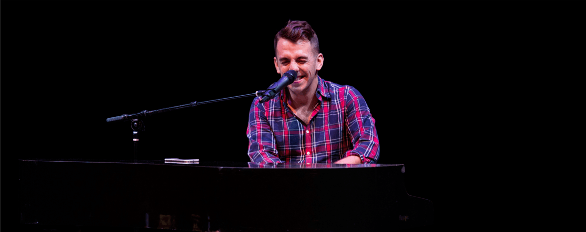 Robert Deason Smiling At Piano