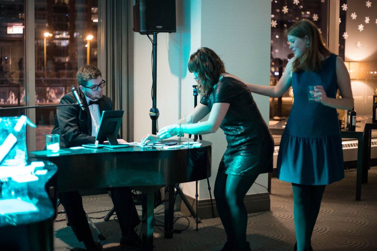 duncan parker at piano with two girls