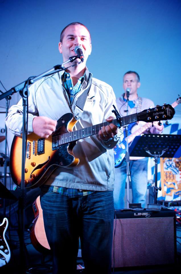 sam baker playing guitar