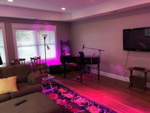 living room with moveable piano shell