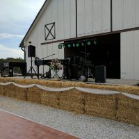 Prairie Cross Farm Wedding tractor stage