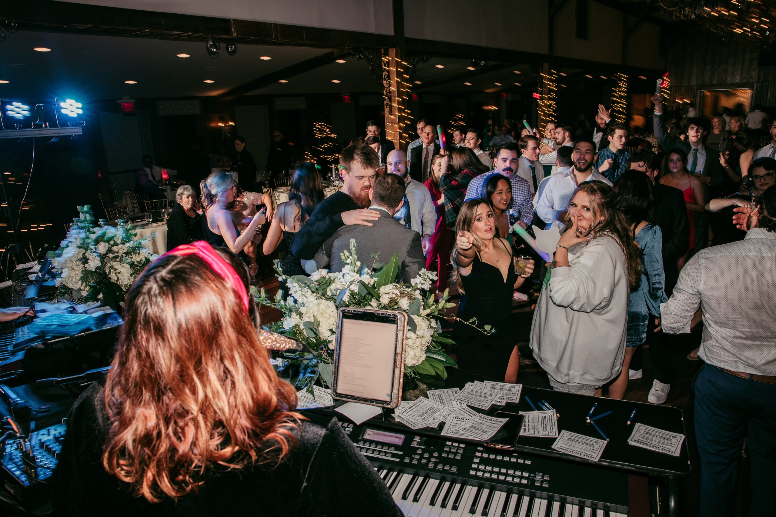 Dueling pianos captivating the wedding crowd