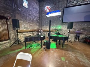 Leroy's Tavern event featuring dueling pianos and delicious crab rangoons in Lawrence
