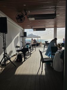 Ariana Santos performing with Felix And Fingers Dueling Pianos at 200 Gulf Dr N in Bradenton Beach, Florida