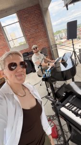 Ashleigh Paige performing with Felix And Fingers Dueling Pianos at Corrigan Station Rooftop Event Space in Kansas City, Missouri