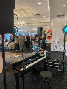 Casey Cross performing with Felix And Fingers Dueling Pianos at Park Ridge Country Club in Park Ridge, Illinois