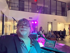 Quintin Dubec performing with Felix And Fingers Dueling Pianos at Westwood School in Addison, Texas