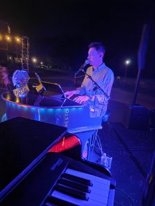 Louie Juarez performing with Felix And Fingers Dueling Pianos at Hyatt Regency Lost Pines Resort and Spa in Cedar Creek, Texas