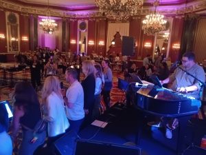 Christopher Heroldt performing with Felix And Fingers Dueling Pianos at The Palmer House in Chicago, Illinois