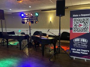 Maxwell Ward performing with Felix And Fingers Dueling Pianos at Banquets of Minnesota in Fridley, Minnesota
