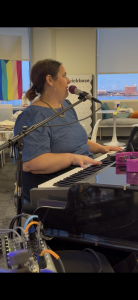 Katie Cronin performing with Felix And Fingers Dueling Pianos at Quickbase in Boston, Massachusetts