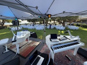 TJ Young performing with Felix And Fingers Dueling Pianos at Sheraton San Diego Hotel & Marina in San Diego, California