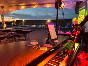 Maxwell Ward performing with Felix And Fingers Dueling Pianos at Northwest Respiratory Services in Eagan, Minnesota