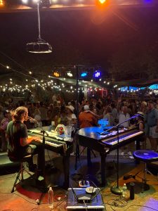 Isaac Cooremans performing with Felix And Fingers Dueling Pianos at Angels Icehouse in Spicewood, Texas