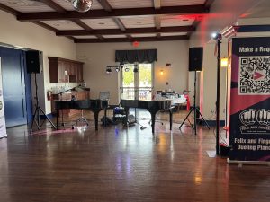 Meny Leizerovich performing with Felix And Fingers Dueling Pianos at North Port Area Chamber of Commerce in Port Charlotte, Florida