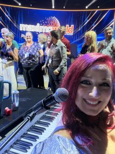 Theresa Romack "Dani Ivory" performing with Felix And Fingers Dueling Pianos at Gaylord Opryland Resort & Convention Center in Nashville, Tennessee