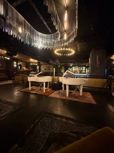 TJ Young performing with Felix And Fingers Dueling Pianos at Pendry San Diego in San Diego, California
