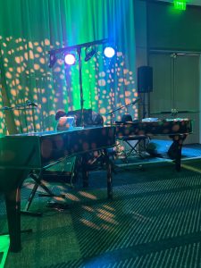 Bri Little performing with Felix And Fingers Dueling Pianos at Hyatt Regency Portland in Portland, Oregon